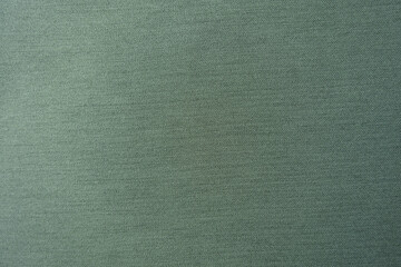 View of reseda green polyester fabric with herringbone pattern from above