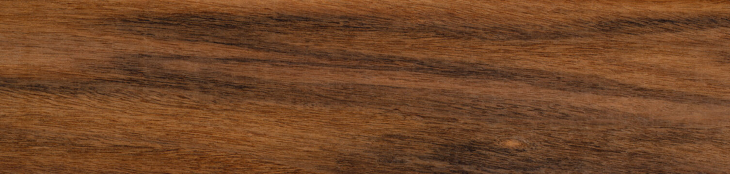 Rich, textured santos rosewood or palisander wooden surface showcasing natural patterns and warm tones