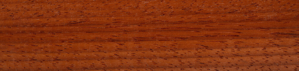Close-up of exquisite paduca veneer, a symphony of natural elegance and warmth
