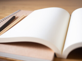 blank note book empty notebook paper page design white clean diary notepad planner business plan sharp black pencil art drawing object on brown wooden table decoration background selected focus