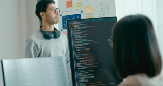 Group adult Asia male female software developers mentor leader manager talk strategy plan to executive write prompt AI bot IT app program nomad, video game, data center. Whiteboard slideshow code.