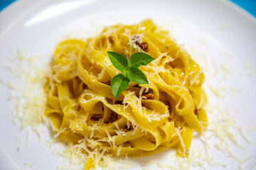 Fettuccine carbonara pasta with basil