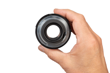 Closeup of a Camera Lens Held in a Hand Isolated On a Transparent Background