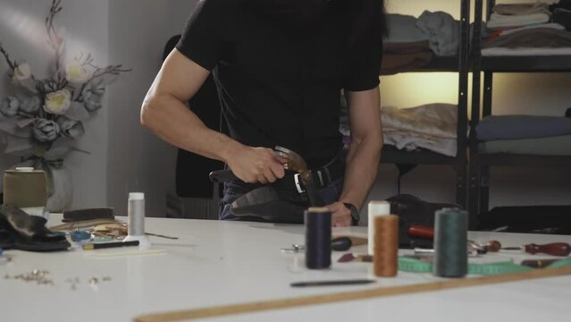 A shoemaker in the process of repairing shoes