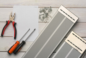 Infrared air heater panel isntallation concept background. Top view. Heating equipment list.