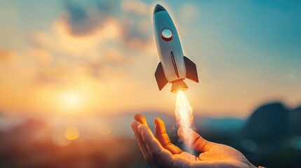 Businessman-controlled rocket is launching and soaring from hand into the sky for growing business, fast business success, and startup business concept