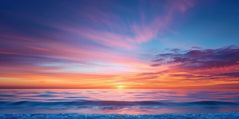 Idyllic sunset sky background over sea with colorful sunlight reflection on motion blur of flowing water surface in panoramic view, tranquil seascape scene