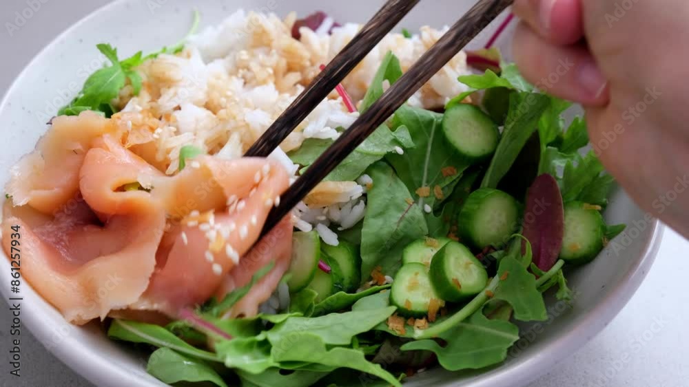 Wall mural Poke salad - salmon with rice and cucumber.