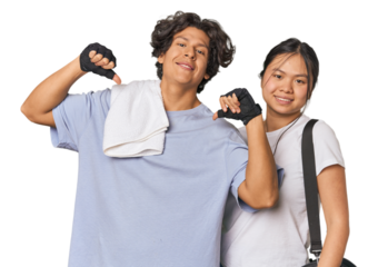 Young interracial athletic couple in studio feels proud and self confident, example to follow.