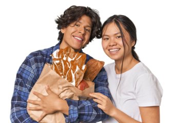 Multiracial young couple shopping for groceries in studio