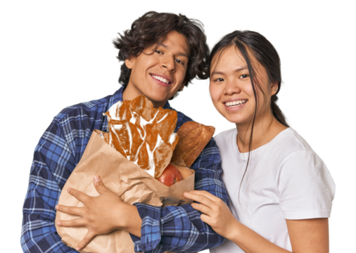 Multiracial young couple shopping for groceries in studio - Powered by Adobe