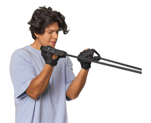 Young Latino man exercising with resistance bands in studio