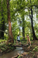 Happy young couple hikers in nature together