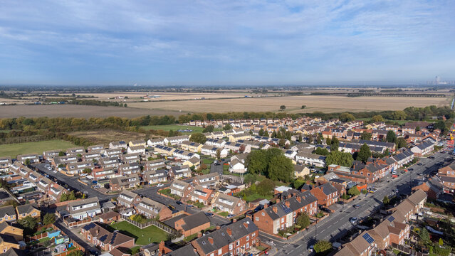 Aerial drone photo of the village of Moorends in the north-east of the Metropolitan Borough of Doncaster, South Yorkshire showing residential housing estates.