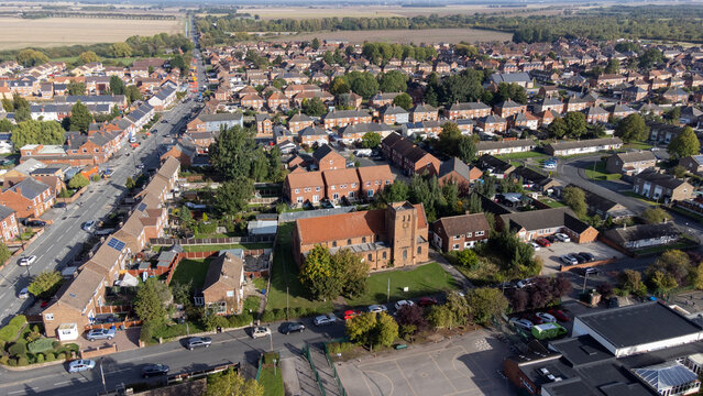 Aerial drone photo of the village of Moorends in the north-east of the Metropolitan Borough of Doncaster, South Yorkshire showing residential housing estates.