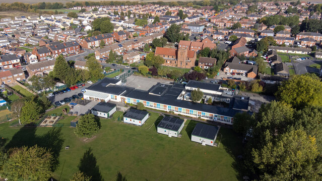 Aerial photo of the village of Moorends in the north-east of the Metropolitan Borough of Doncaster, South Yorkshire showing a British school building residential housing estates.