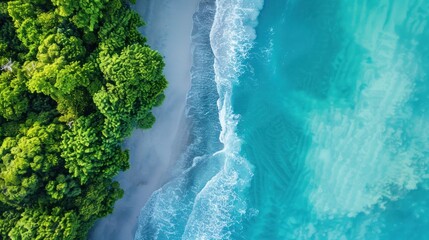 Aerial view of blue ocean waves along the beautiful natural beach of the Andaman Sea. Southern Thailand