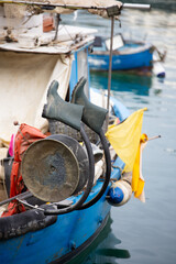 Old fishing boat filled with odds and ends, showcasing nautical charm and maritime nostalgia in photography