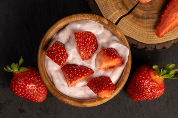 yogurt made from milk with added flavor and pieces of ripe strawberries