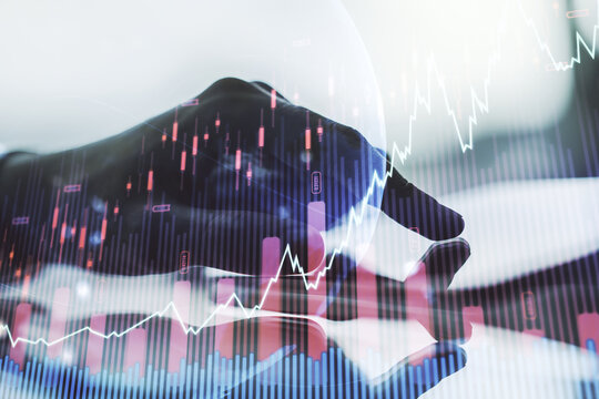 Multi exposure of abstract creative financial graph with world map and finger presses on a digital tablet on background, forex and investment concept