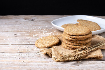 Healthy oatmeal cookies on wooden table. Copy space