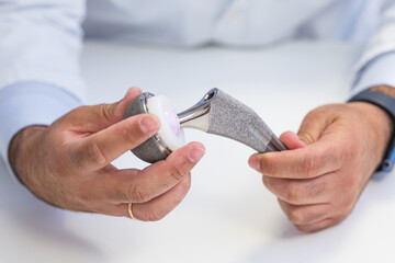 Orthopedic Surgeon Demonstrating Hip Prosthesis