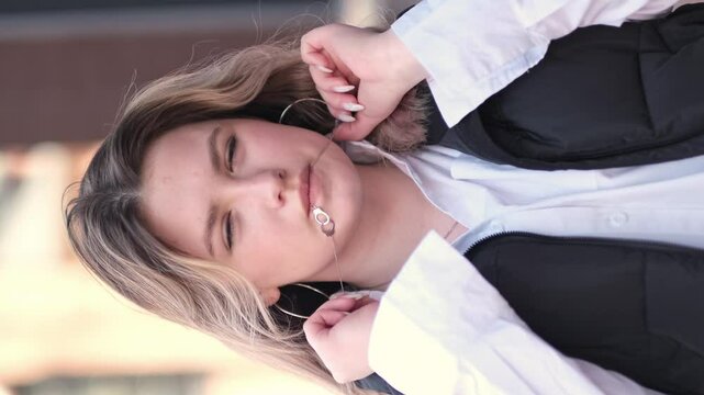 young woman dances gracefully, holding a necklace between her lips, her expression serious yet captivating. This scene blends elegance with a touch of mystery, highlighting the art of self-expression