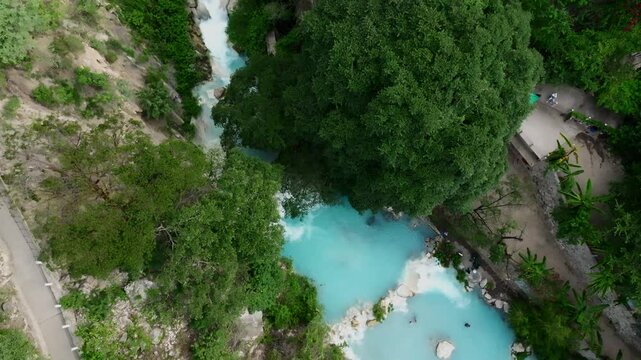High-altitude drone aerial of Tolantongo hot springs and turquoise water in Mexico&rsquo;s Mezquital Canyon