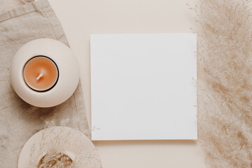 Beautiful postcard with copy space and candles with pampas grass, top view. Aesthetic paper mockup card for greeting, invitation and design
