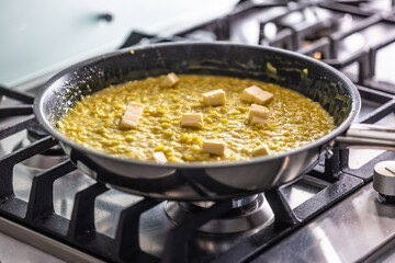 Part of making risotto is adding butter at the end.