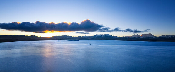 The sunrise of Kula Kangri and Pumoyum Co lake in Tibet