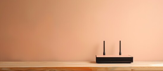 Contemporary Wi-Fi router displayed on a table against a smooth beige wall with available copy space image.