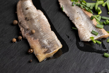 salted herring fillet on the table