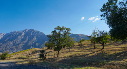 Fototapeta premium Gardens are visible at the foot of the mountain