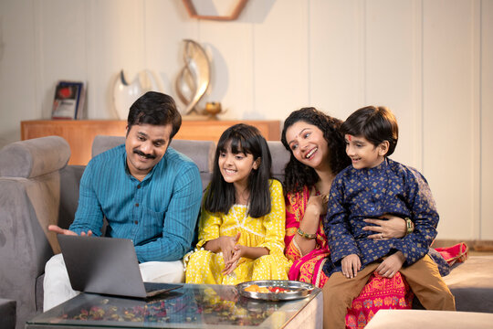 Peaceful Family Talking On Video Call On Laptop