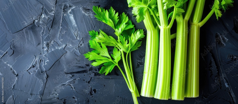 Aufkleber Celery sticks displayed with a dark background for copy space image.