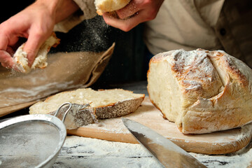 man holding slices of freshly cut bread