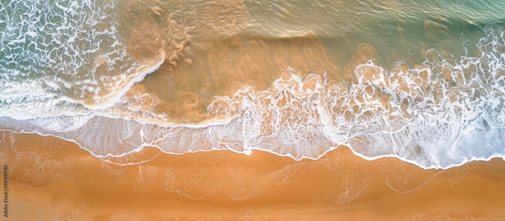 Poster Aerial view of a sandy beach with undulating patterns. Ideal summer backdrop with plenty of copy space image.