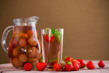 Sweet refreshing berry compote of ripe strawberries in a decanter