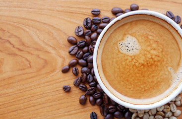 Crema espesso coffee cup, espresso  coffee and coffee bean on wooden table