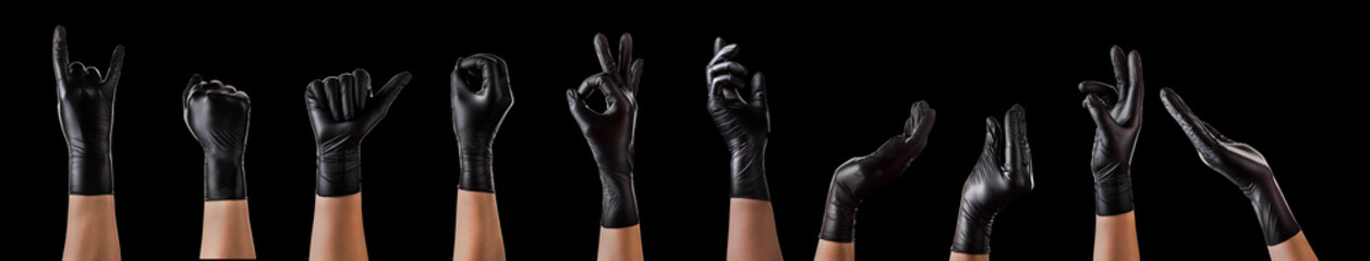 Hands in black gloves showing different gestures, pointing and showing signs