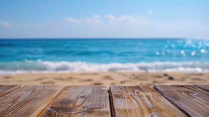 Fototapeta premium A serene view of a wooden deck facing a sandy beach with a clear blue ocean and sky, perfect for summer and vacation themes.