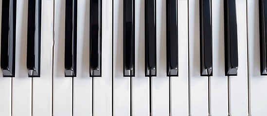 Naklejka premium A composition of piano keys and unoccupied white areas for writing text or inserting images, providing ample copy space image.