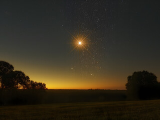 Single star shining brightly in a dark night sky