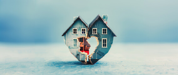 Broken heart shaped house representing divorce and property division