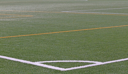 The corner of an artificial turf soccer field