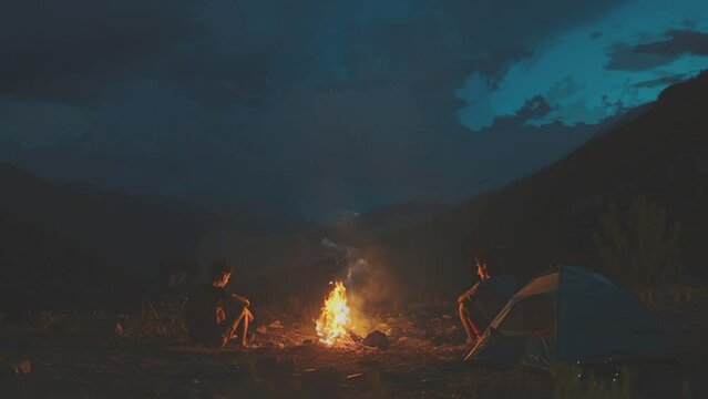 camping with a campfire in the beautiful mountains
