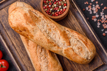 Crispy mini baguette with seeds and grains, salt and spices