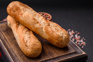Crispy mini baguette with seeds and grains, salt and spices