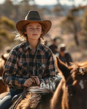 Young Jackaroo Mustering Cattle in the Australian Outback

